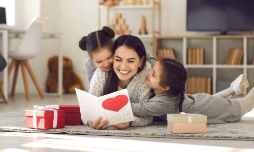 young-woman-getting-presents-from-kids-1